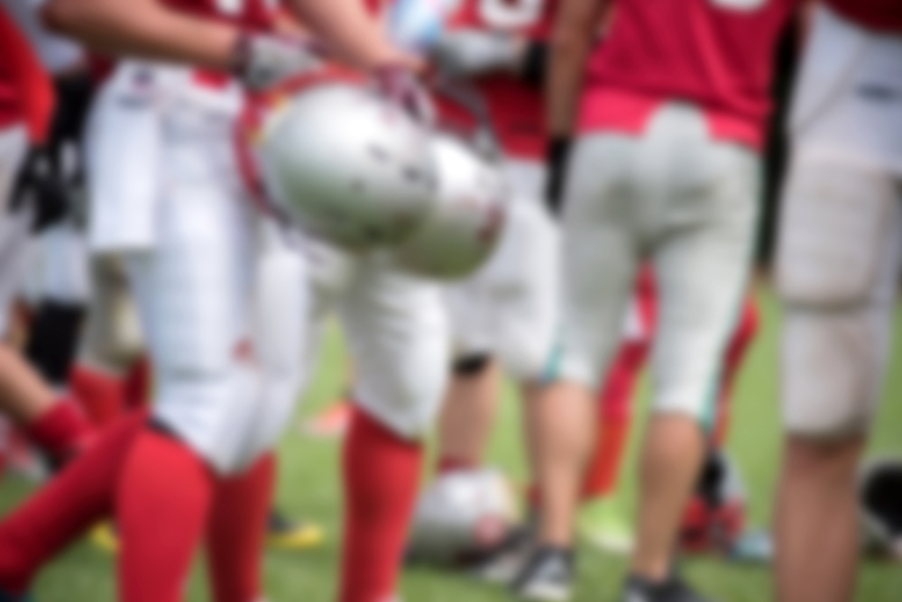 Blurred,American,Football,Players,In,Action,During,A,Match