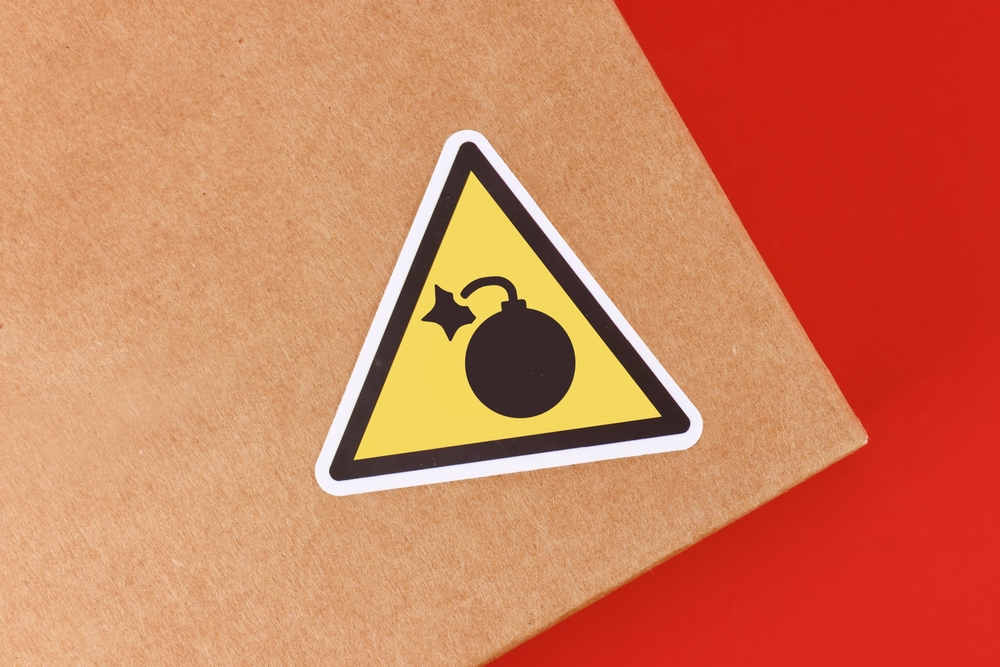 Triangular,Warning,Label,With,Bomb,Icon,On,Parcel