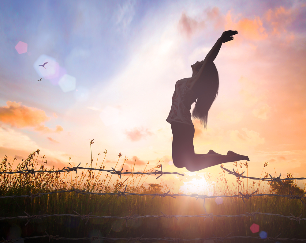 World,Mental,Health,Day,Concept:,Silhouette,Of,A,Girl,Jumping