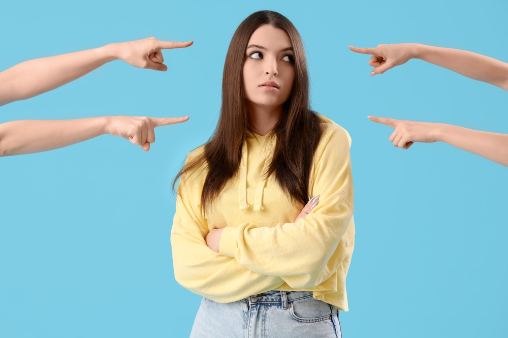 People,Pointing,At,Young,Woman,On,Blue,Background.,Accusation,Concept