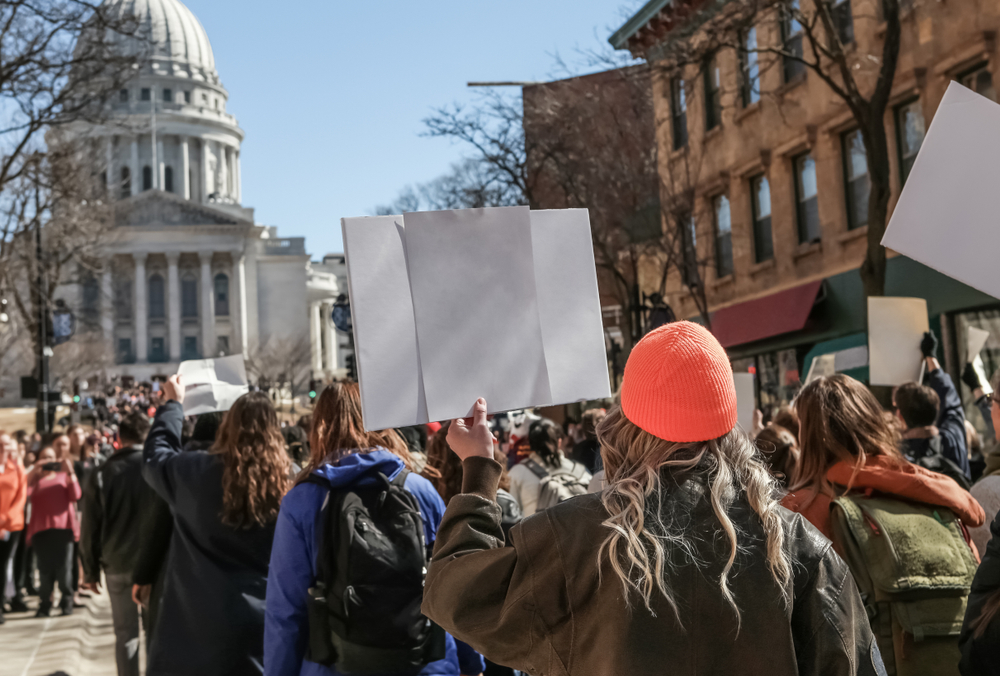 Teens,Marching,To,The,Capitol,In,Protest,Focus,On,Orange