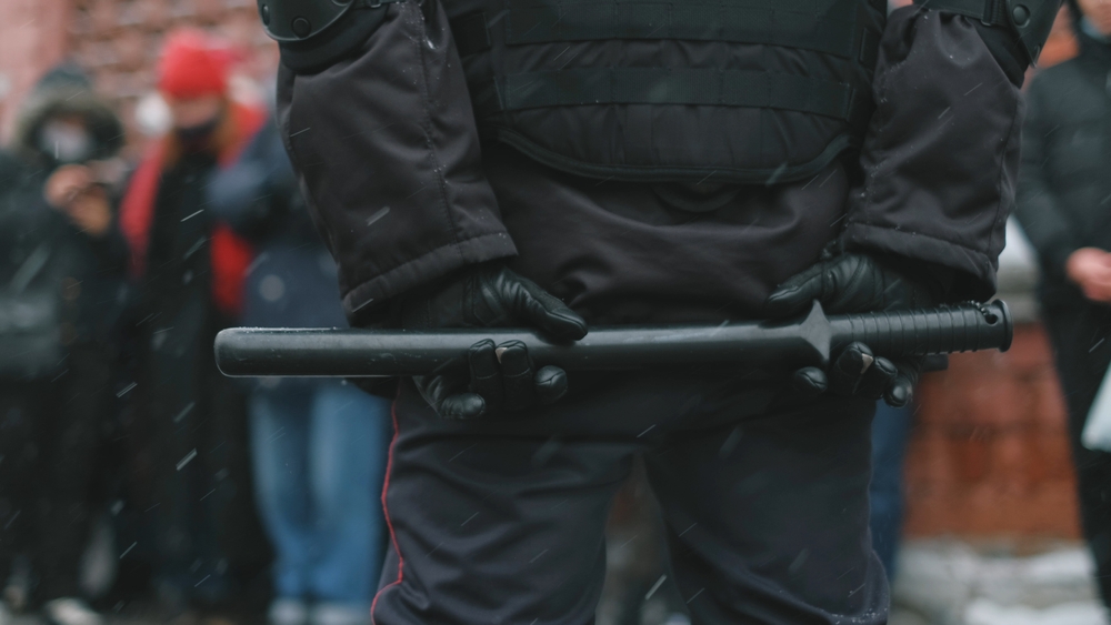 Political,Prisoners,In,Russia.,Police,Riot,Team,With,Batons,Block