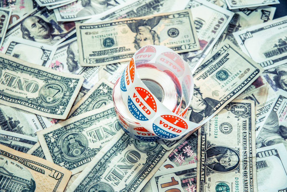 I,Vote,Today,Stickers,On,A,Pile,Of,American,Dollar