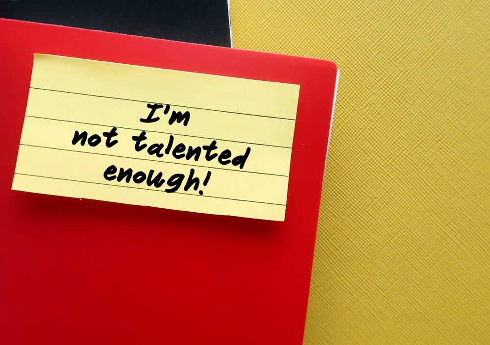 Red,Notebook,With,Stick,Note,Written,-,I,Am,Not