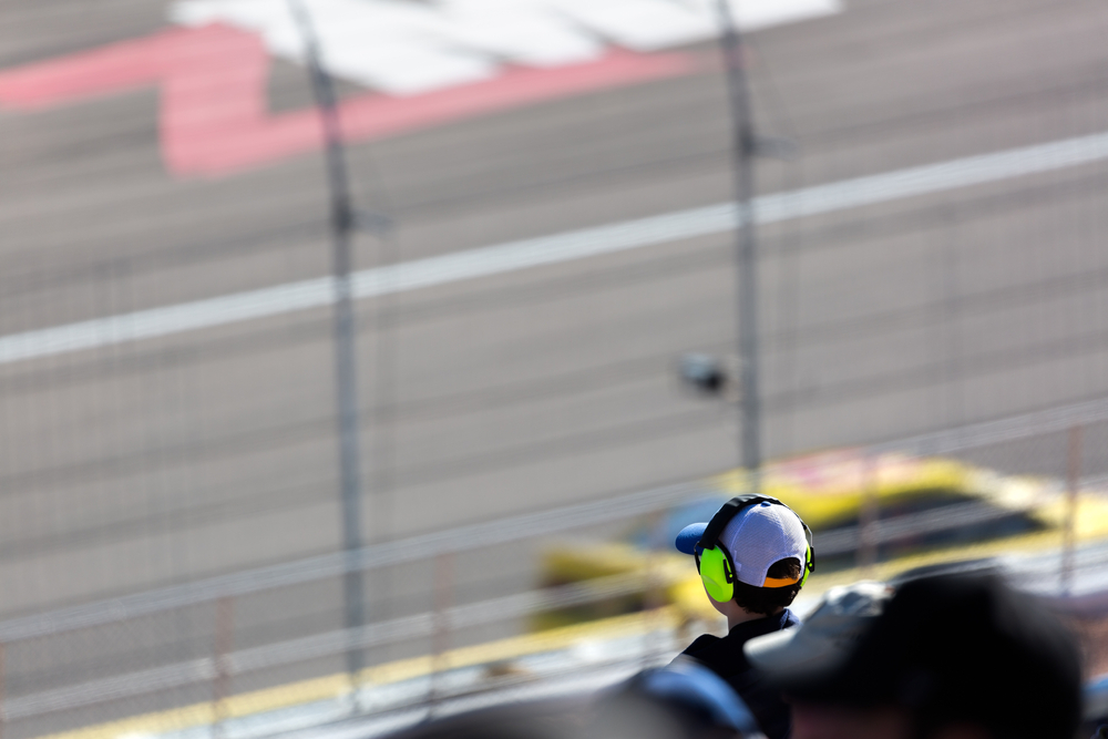 A,Young,Boy,Sits,In,The,Stands,Enjoying,A,Car