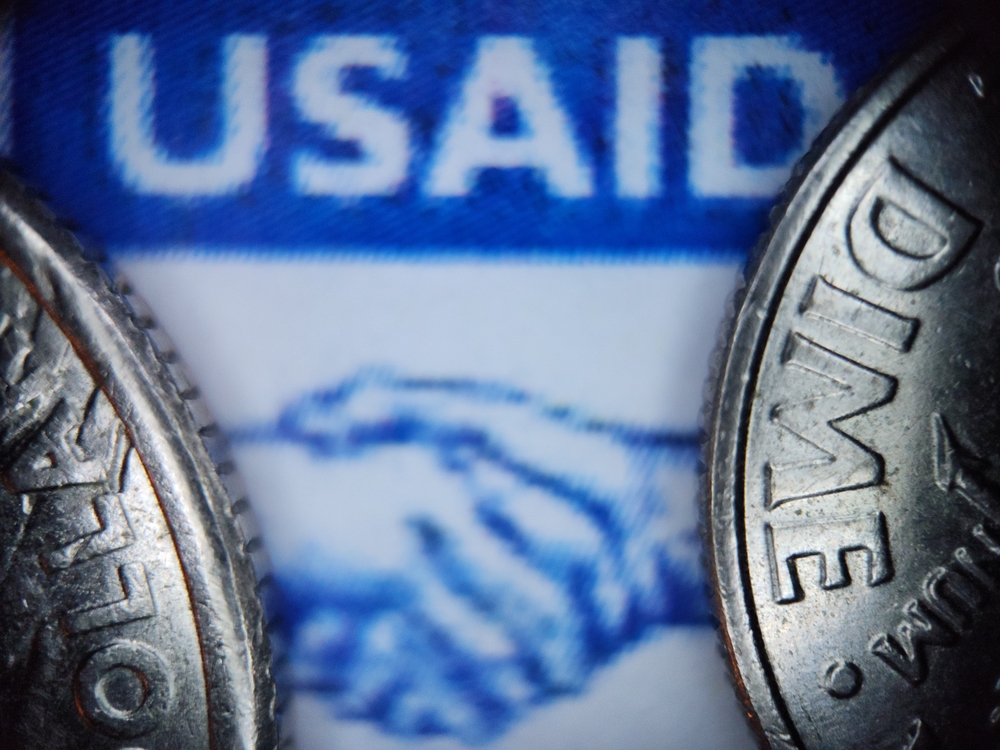 Usaid,Close-up,With,Silver,Coins,In,Foreground,,Concept,Of,International
